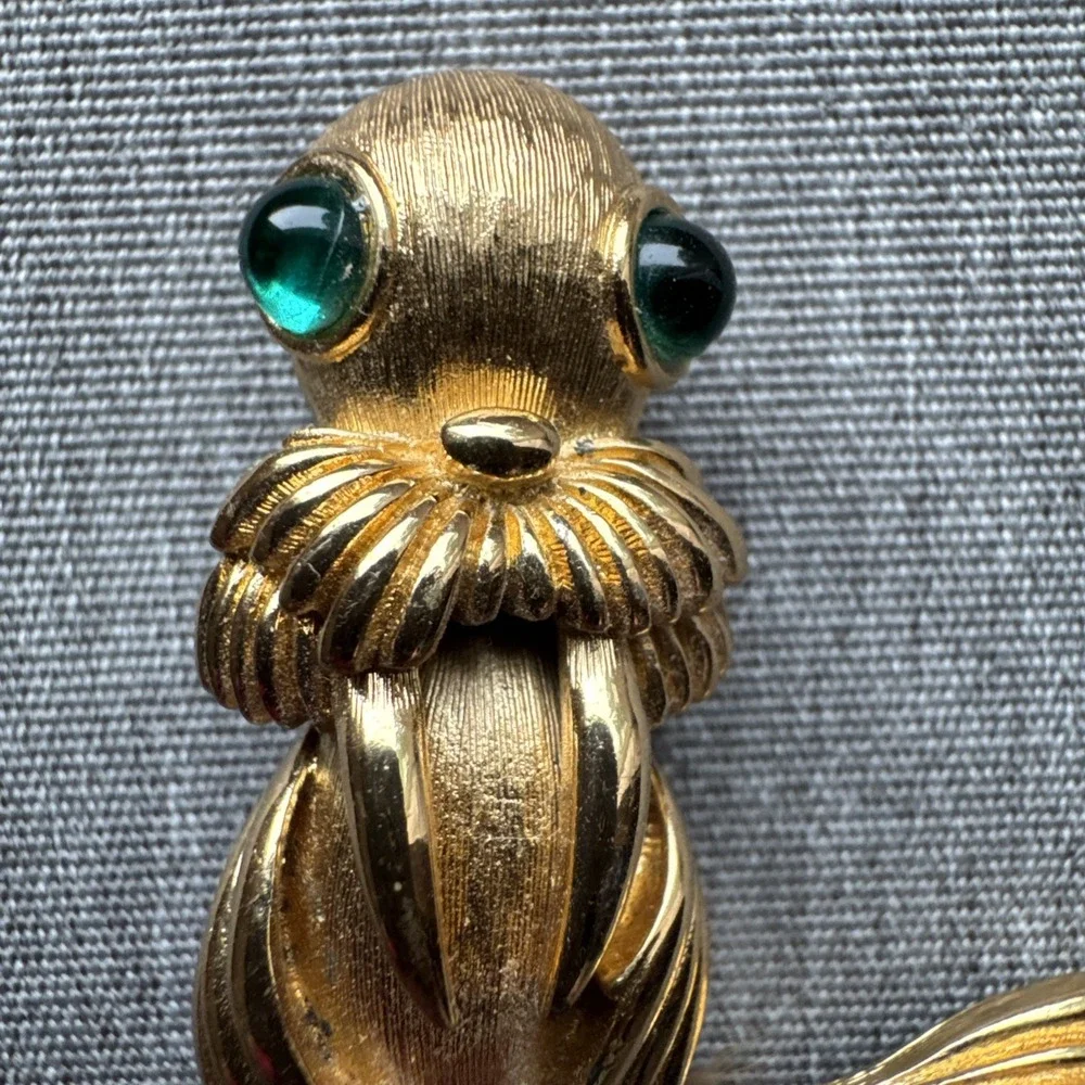 Vintage Monet Sea Lion Figural Brooch Gold‎ Tone Green rhinestone Cabochon Eyes